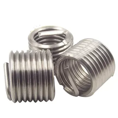 Tanged coil thread inserts
